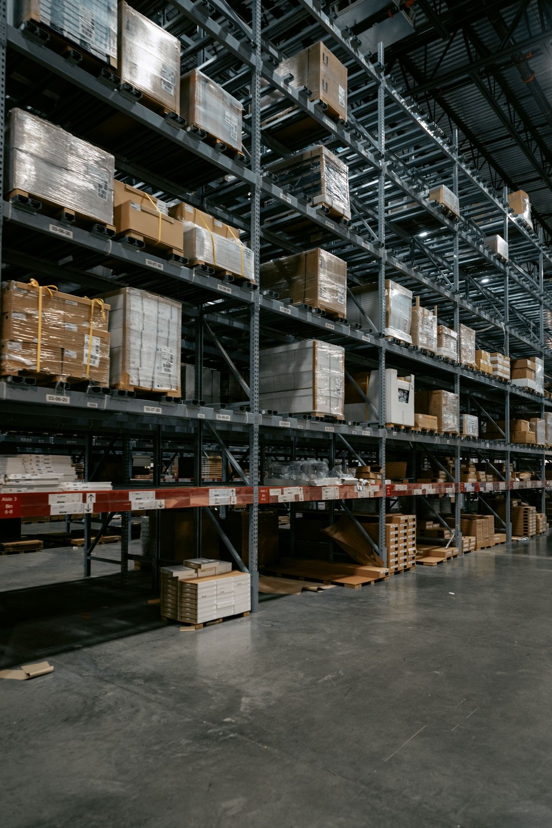 Palletized goods on tall warehouse shelving